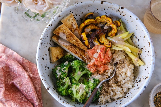 macro bowl with colorful vegetables and brown rice