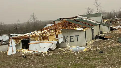 Missouri State Trooper Damage from a tornado that touched down on Friday night in Missouri