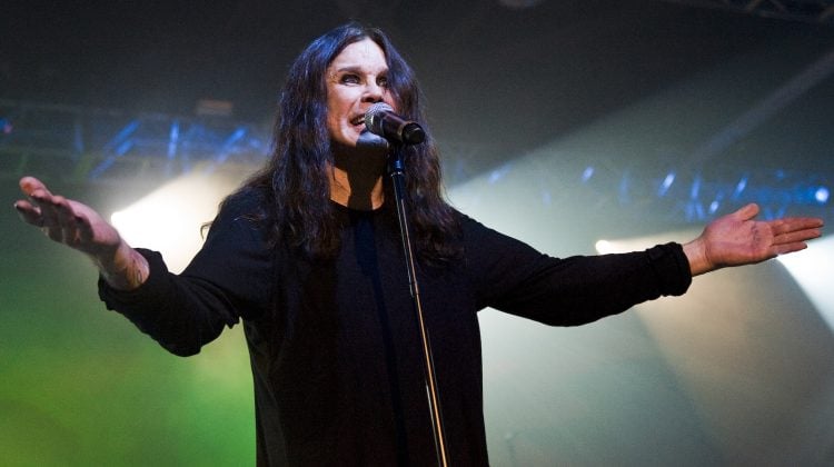 A photo of Ozzy Osbourne performing on stage.