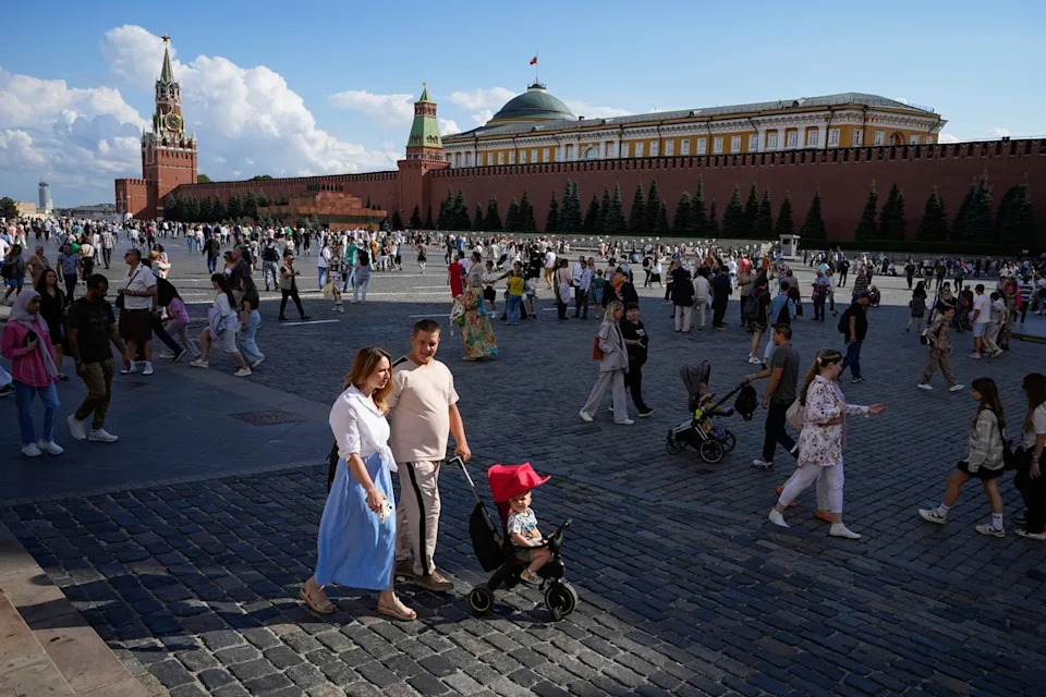 A family walks through Red Square in Moscow, Russia, Sunday, Aug. 4, 2024. (AP Photo/Alexander Zemlianichenko, File) (Copyright 2024 The Associated Press. All rights reserved.)